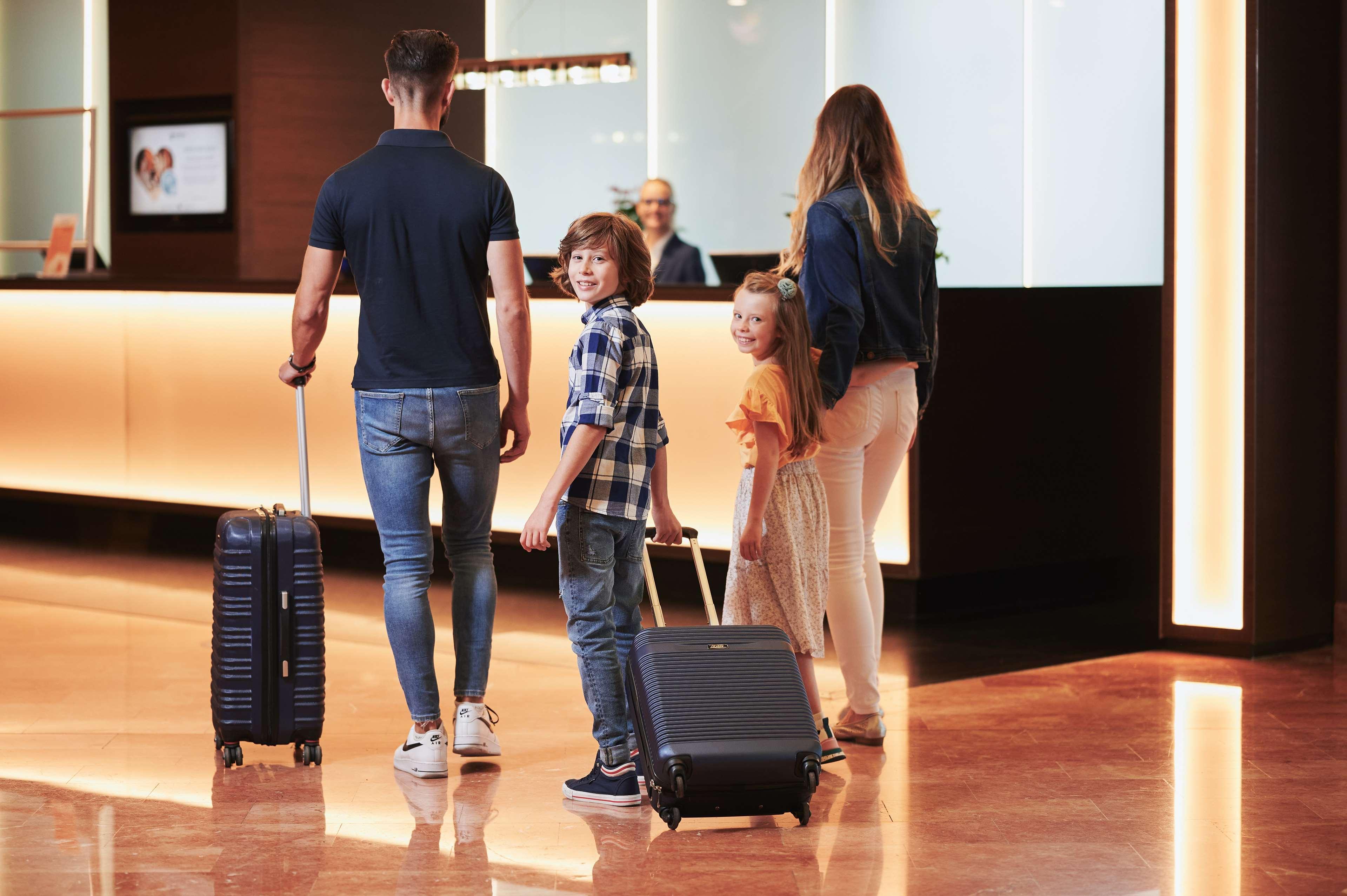 Radisson Blu Sobieski Warsaw Exterior photo Family check-in at a hotel